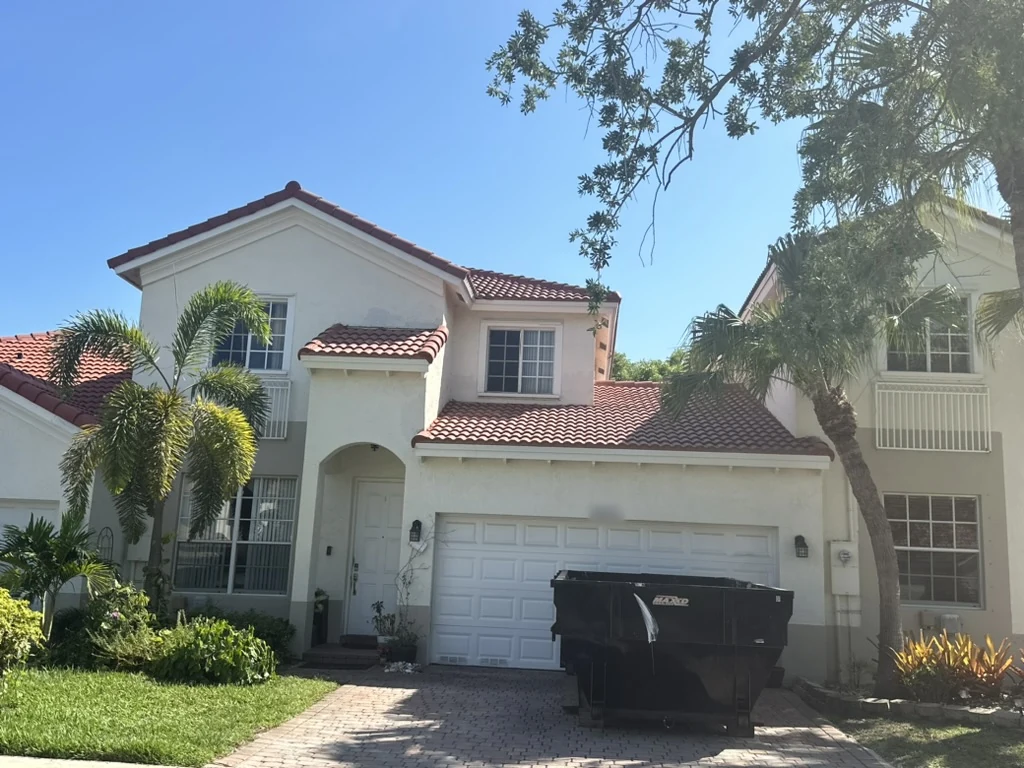 Full exterior view of a concrete tile roof on an attached townhouse in Miramar, Florida, showing the shared roofline.